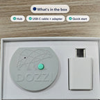 The Dozzi Base and its USB power adapter seated in the retail box tray